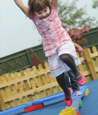 child playing on plank