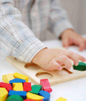 Childcare member of staff with child