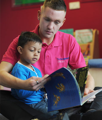 carer reading to child